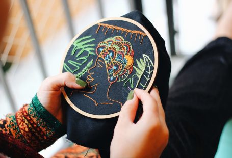 person doing embroidery